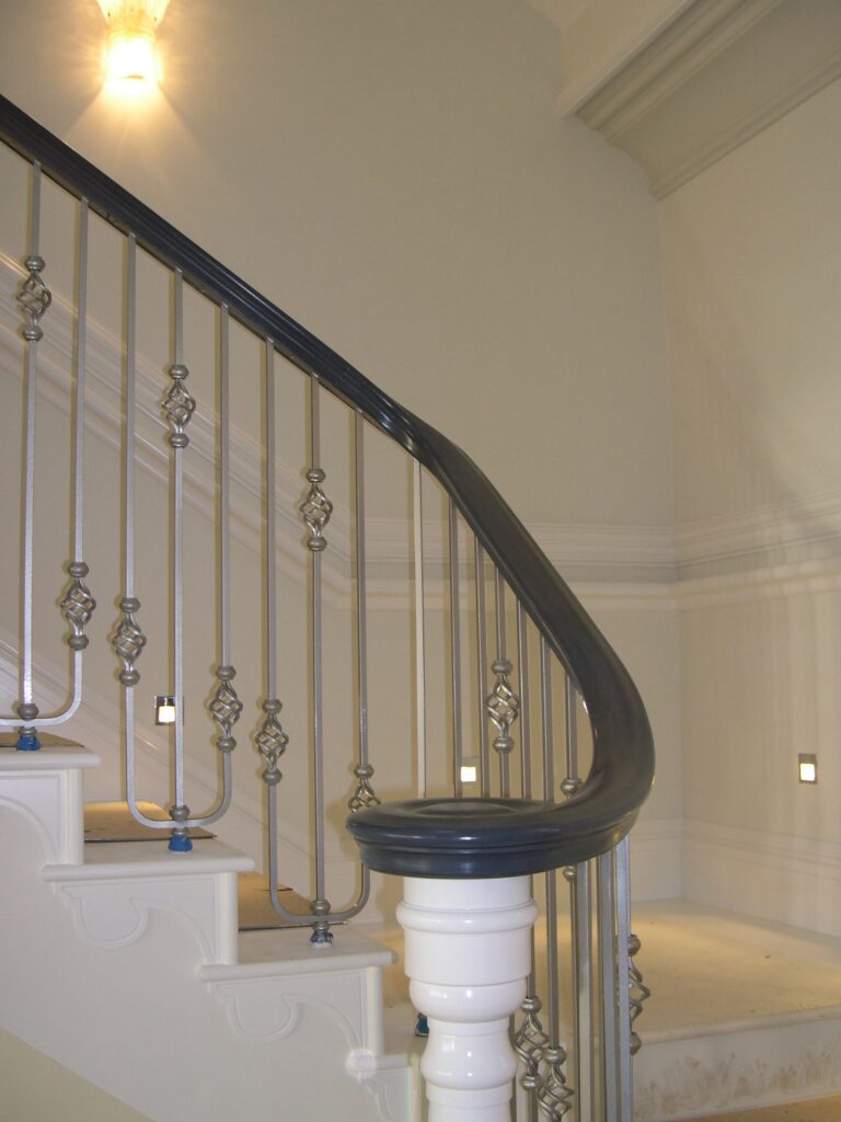 Astley House Timber Staircase With Dark Wood Handrail And Decorative Iron Spindles Painted White Interior View Staircases Balustrade Trinity Joinery Jersey 2500