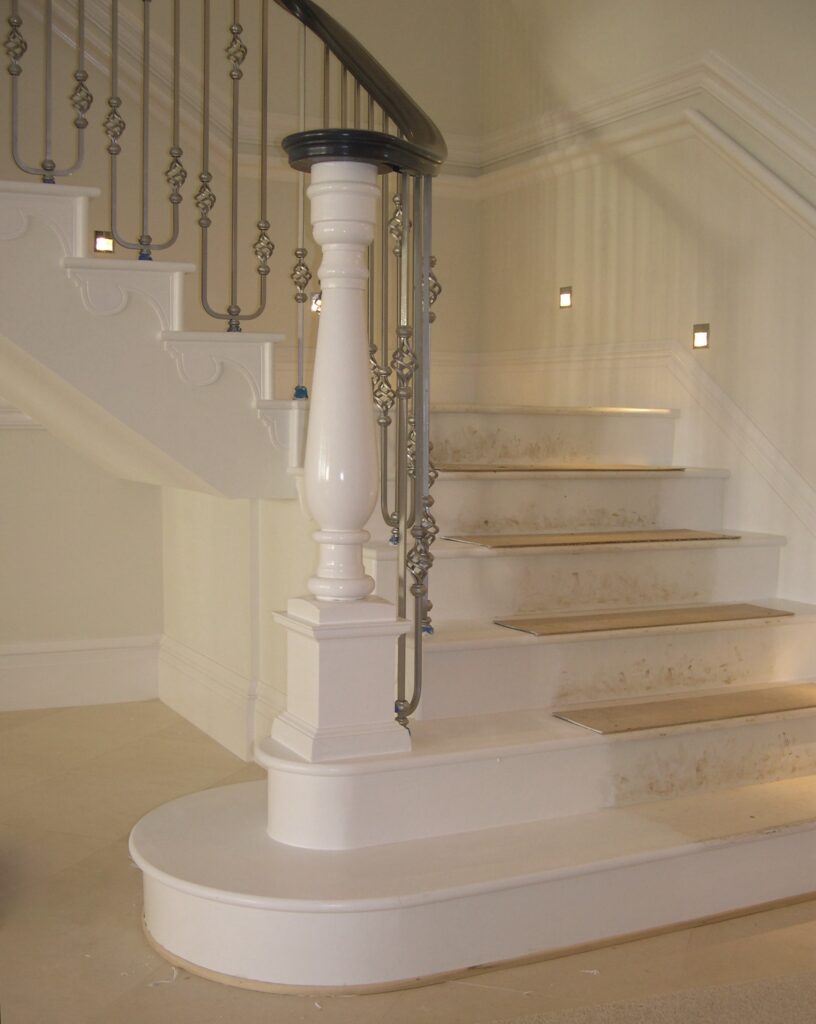 Astley House Timber Staircase With Grand White Newel Post And Ornamental Iron Balustrade Interior View Staircases Balustrade Trinity Joinery Jersey 2500