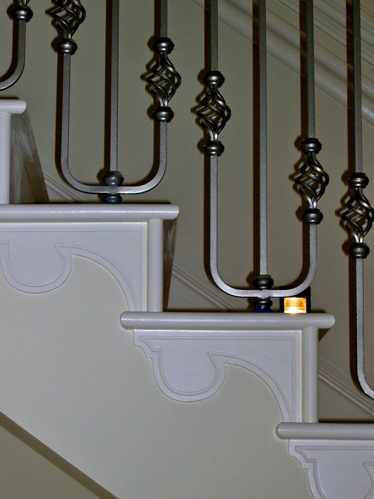 Astley House Timber Staircase With Painted White Stringer And Ornate Iron Balusters Detail View Staircases Balustrade Trinity Joinery Jersey 2500