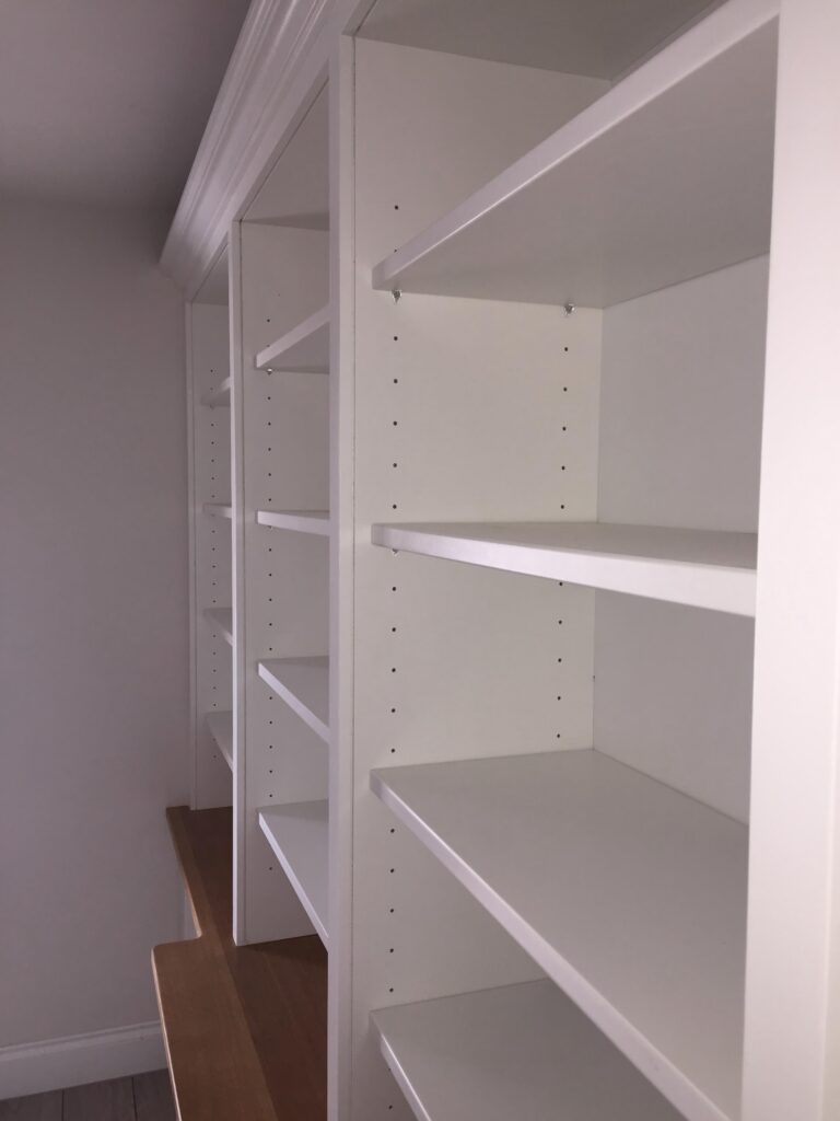 Bespoke Joinery Close Up Of White Fitted Bookcase Shelving With Oak Worktop Cabinets Trinity Joinery Jersey 2500