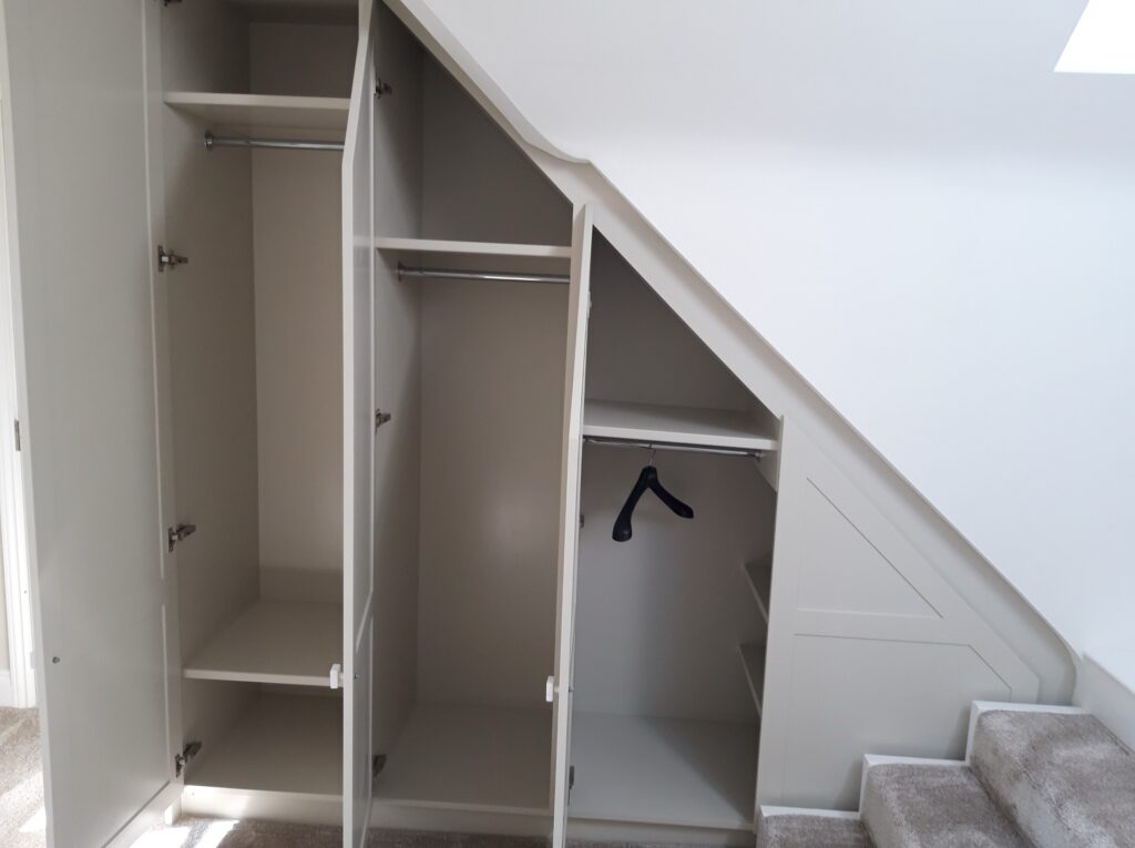 Bespoke Under Stairs Fitted Wardrobe With Hanging Rails And Shelving Jersey Cabinets Trinity Joinery Jersey 2500