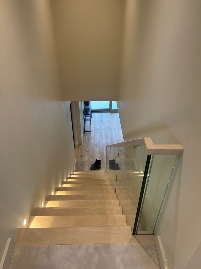 Contemporary Staircase Light Ash Grey With Glass Balustrade Wall Step Lighting Staircases Balustrade Trinity Joinery Jersey 2500