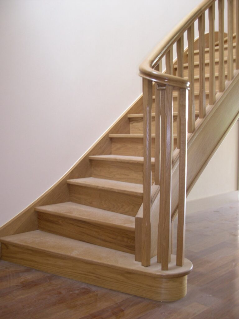 curved oak staircase bespoke joinery jersey staircases balustrade trinity joinery jersey 2500