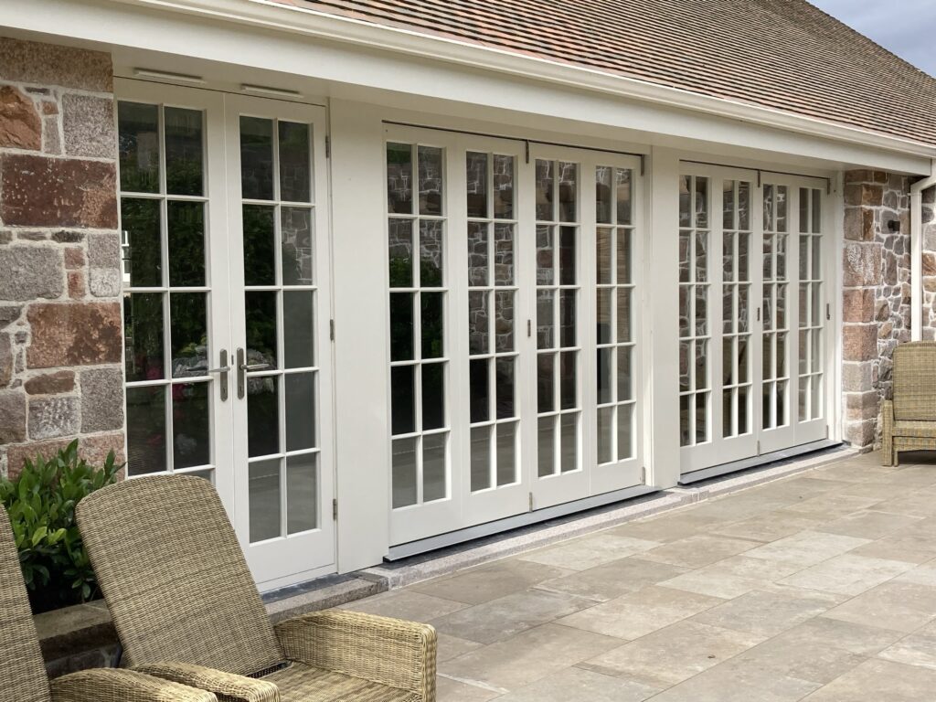French Patio Doors Multiple Glazed Panels In Painted White Finish With Stone Surround.jpg Exterior Doors Trinity Joinery Jersey 2500