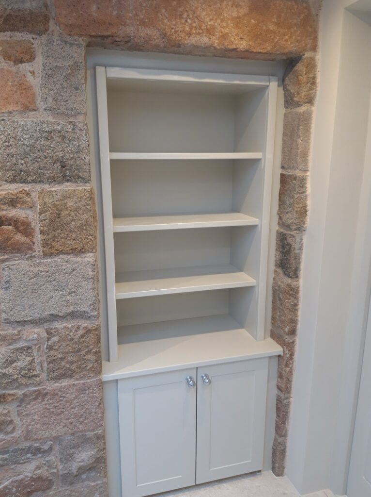 Painted Fitted Alcove Shelving Unit With Cupboard By Trinity Joinery Jersey Cabinets Trinity Joinery Jersey 2500