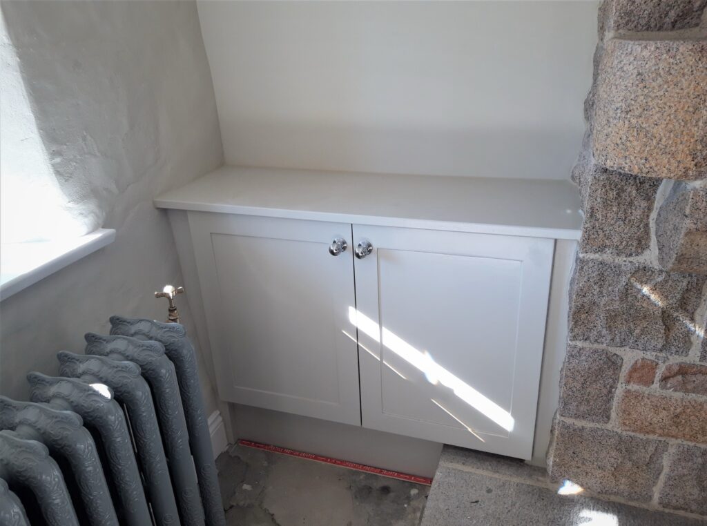 Painted Fitted Cupboard Between Radiator And Stone Wall Cabinets Trinity Joinery Jersey 2500