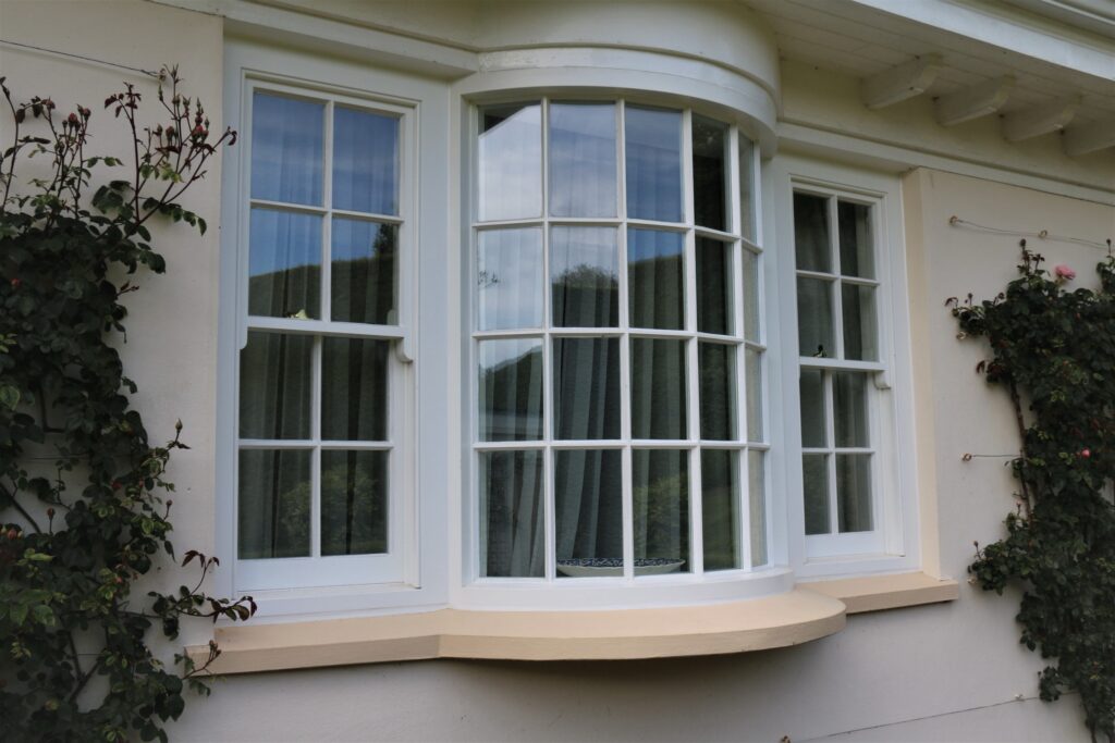 Timber Curved Bay Window Installation With Georgian Bars Painted White Angle View Windows Trinity Joinery Jersey 2500