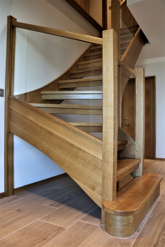 timber oak staircase with glass balustrade angled side view staircases balustrade trinity joinery jersey 2500