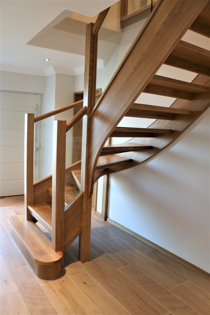 Timber Oak Staircase With Glass Balustrade Curved Side View Staircases Balustrade Trinity Joinery Jersey 2500