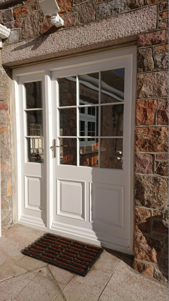 Timber Painted White French Doors Stone Wall Front View Exterior Doors Trinity Joinery Jersey 2500