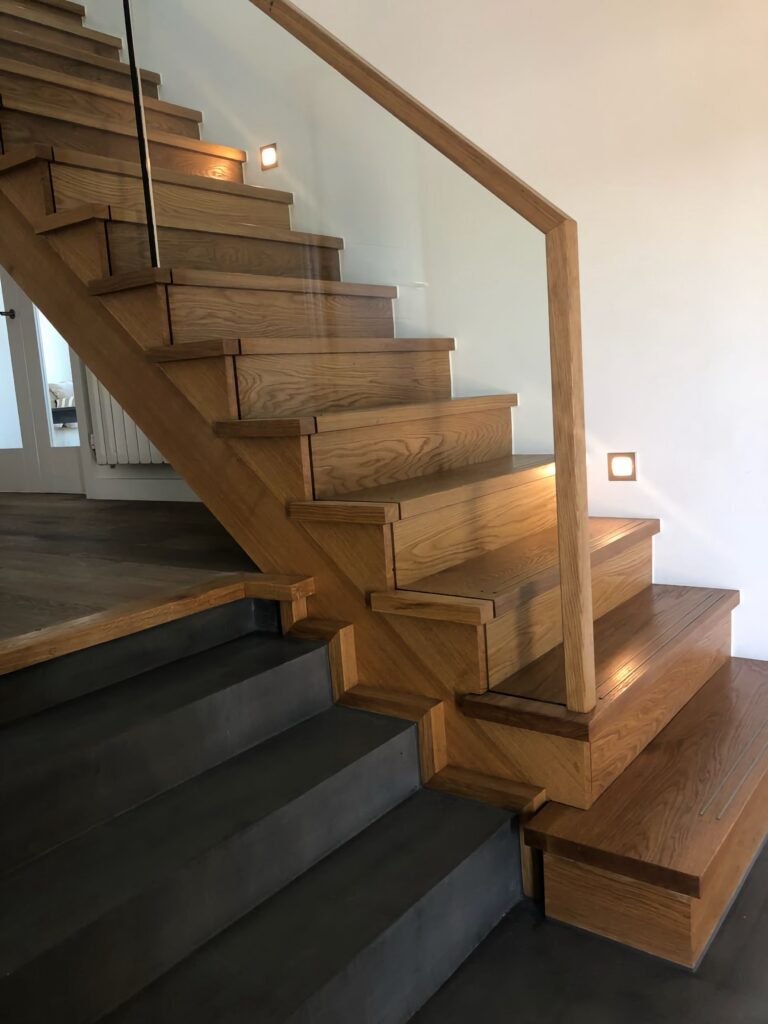 Timber Staircase With Glass Balustrade Close Up Oak Treads And Handrail House Project Staircases Balustrade Trinity Joinery Jersey 2500