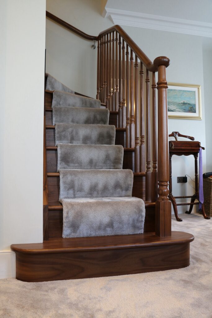 Timber Staircase With Turned Spindles And Carpet Runner Close Up View Staircases Balustrade Trinity Joinery Jersey 2500
