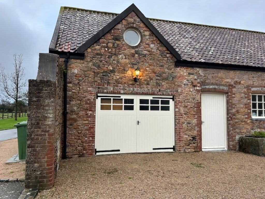Traditional Cream Garage Doors With Windows On Stone House Exterior Doors Trinity Joinery Jersey 2500